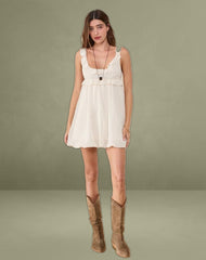 Garistha Babydoll Puffball Mini Dress in Cream
